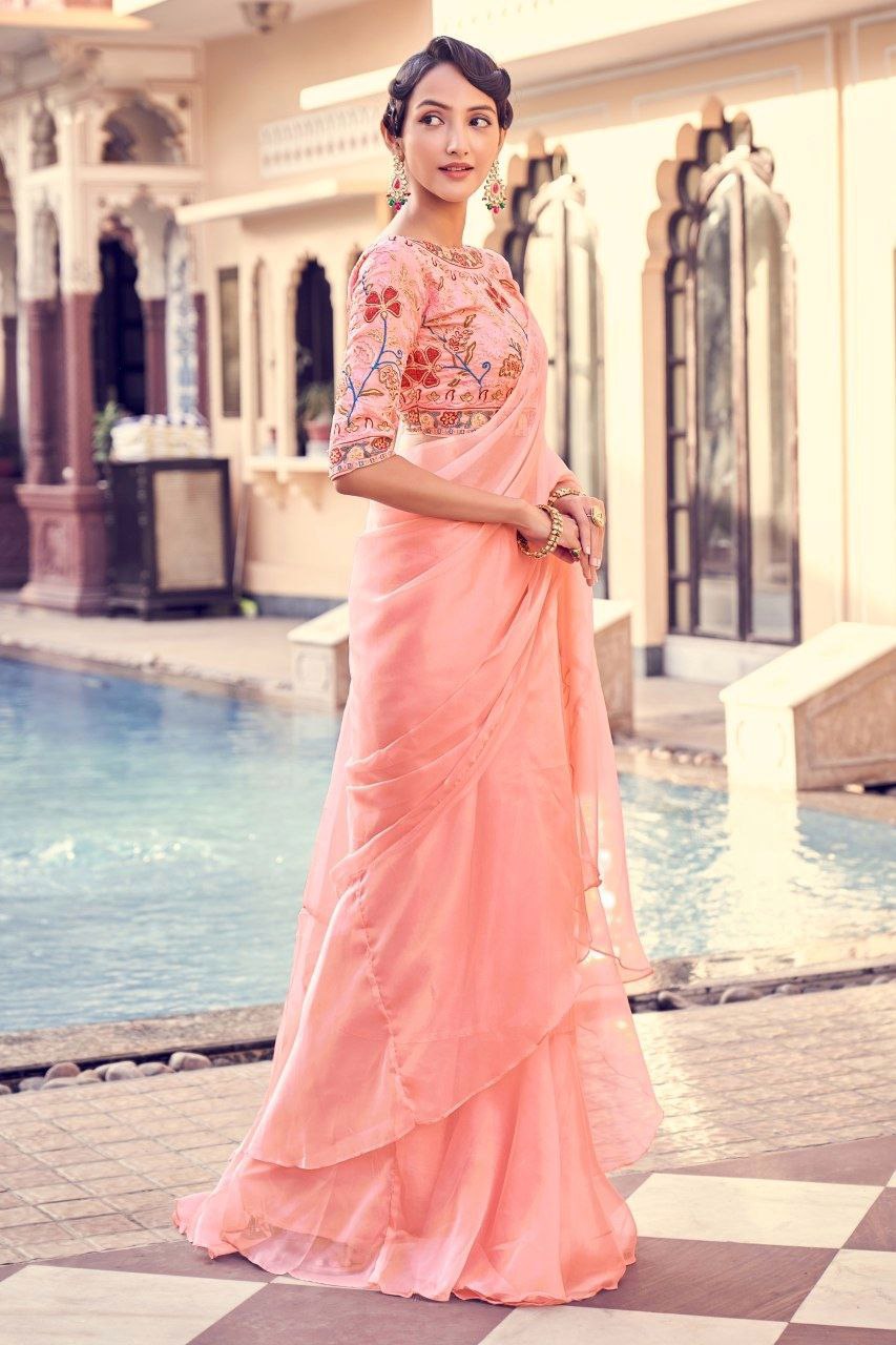 Graceful Peach Pink Organza Saree With Elegant Embroidery Work